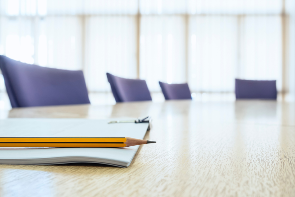 Board room with chairs and a desk