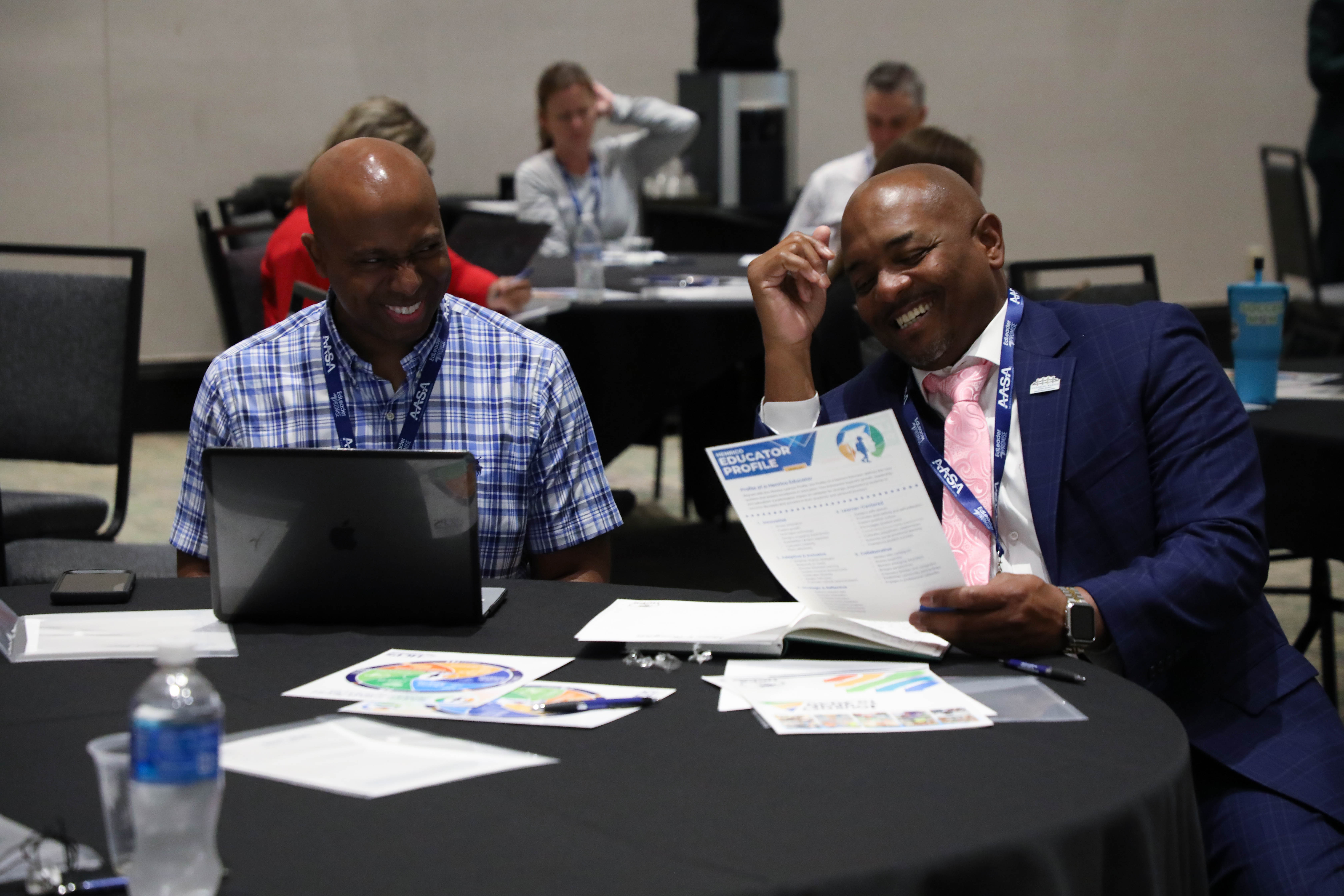 Two attendees laughing