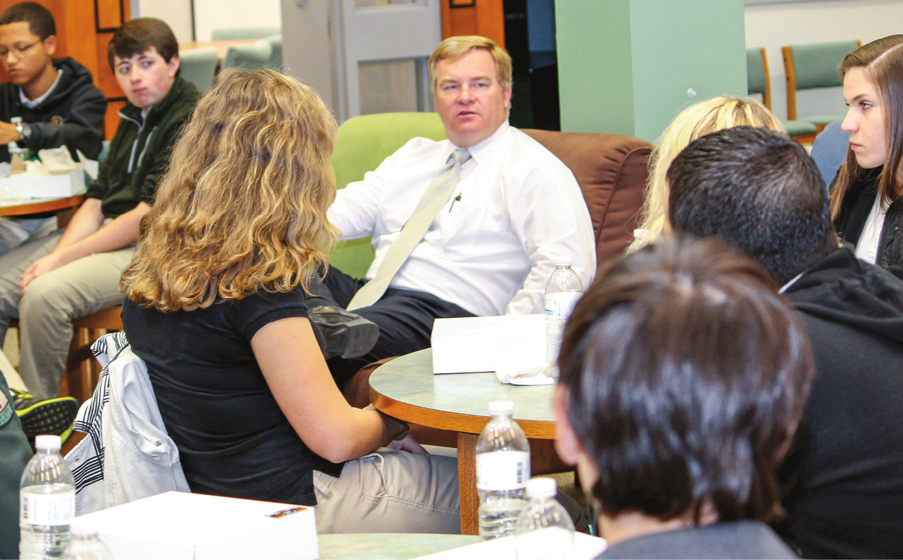 Superintendent Jeffrey Moss (center) meets regularly with a student advisory body in Beaufort County, S.C., which flipped the start times of elementary and secondary schools in 2014.