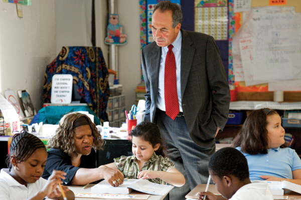 Jeffrey Young standing in classroom