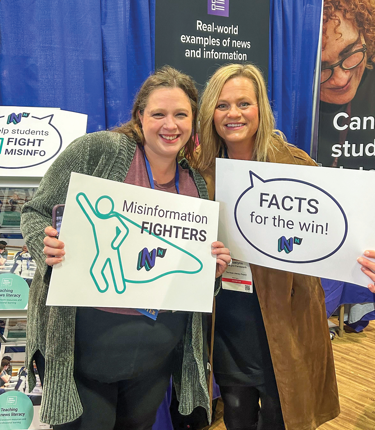 Shaelynn Farnsworth with another woman holding signs about fighting misinformation