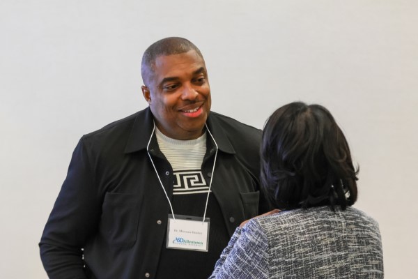 Beasley speaking with steering committee member