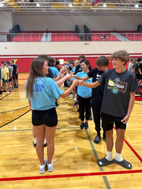 Link Crew Leaders lead freshmen activities in the gym